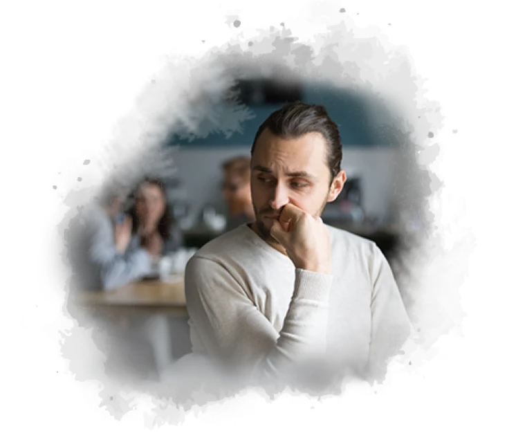 Thoughtful man showing signs of anxiety and stress while sitting in a workplace environment